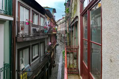 a narrow alley with buildings in a city at Oldtown Studio in Porto