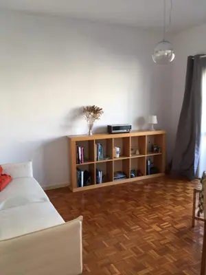 a bedroom with a bed and a book shelf at 26/3 Casa da Música in Porto