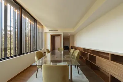 a hotel room with a bed and a desk and a chair at Boeira Garden Hotel Porto Gaia, Curio Collection by Hilton in Vila Nova de Gaia