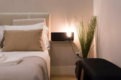 a bedroom with a bed with a pillow and a lamp at LovelyStay - Porto Peaceful Living W/ Backyard in Porto