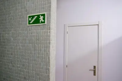 a sign on a brick wall next to a door at Change The World Hostels - Porto - Santa Catarina in Porto