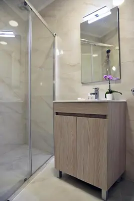 a bathroom with a sink and a shower at Hotel Visconde in Porto