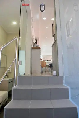 a set of stairs in a room with a stair case at Hotel Visconde in Porto