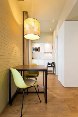 a dining room with a table and yellow chairs at RVA - Porto Central Flats in Porto