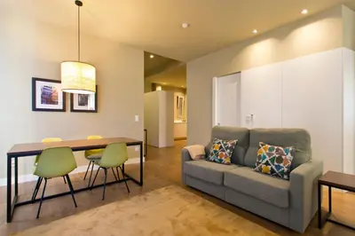 a living room with a couch and a table at RVA - Porto Central Flats in Porto