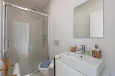 a bathroom with a toilet and a sink and a shower at Sweet Flat 4Two in City Center, Balcony & Air Conditioning in Porto