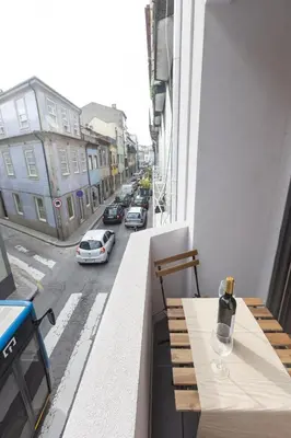 a table on a balcony with a view of a street at Sweet Flat 4Two in City Center, Balcony & Air Conditioning in Porto