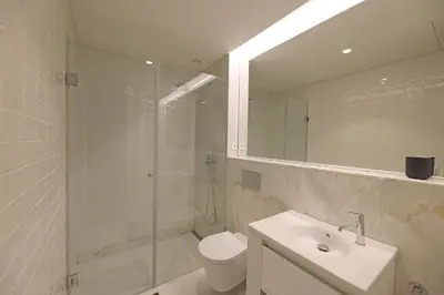 a bathroom with a shower and a sink and a toilet at FLH Porto Spacious Duplex in Porto