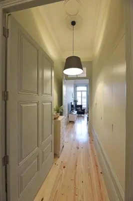 a hallway with a door and a living room at FLH Porto Trendy Flat in Porto
