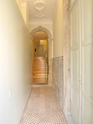 a hallway with an archway and a tile floor at FLH Porto Trendy Flat in Porto
