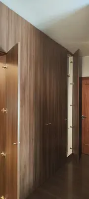 a room with wooden cabinets and a door at Suite Camões in Porto