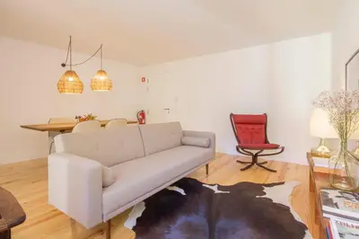 a living room with a couch and a table at Clérigos 168 in Porto