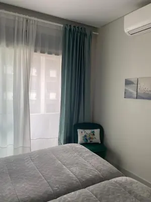 a bedroom with a bed and a window at A&R Bolhão Apartment in Porto