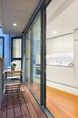 a dining room with a table and a kitchen at Stylish apartment at Bolhao in Porto