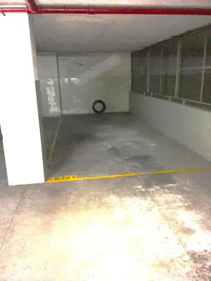 an empty garage with a room with a yellow line at Alegria Cozy com Terraço - Centro do Porto in Porto