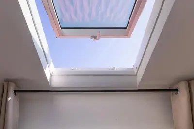 a skylight in the ceiling of a bathroom at Batalha Mezzanine Penthouse in Porto