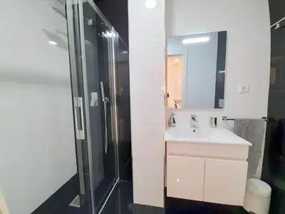 a bathroom with a sink and a shower at VB Porto City Studio, by Flat in Porto in Porto