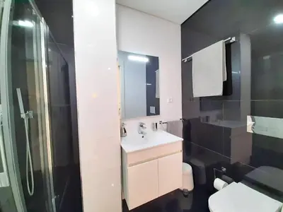 a bathroom with a sink and a toilet and a shower at VB Porto City Studio, by Flat in Porto in Porto