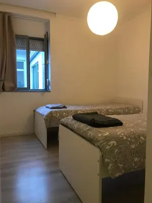a room with two beds and a window at City Heart Place 4 in Porto