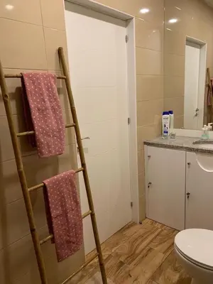 a bathroom with a towel rack next to a toilet at City Heart Place 4 in Porto