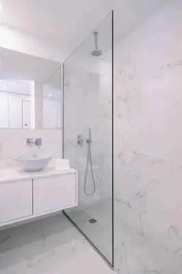 a white bathroom with a shower and a sink at BBA Apartments Palácio II - Garden View, Gym & Free Parking in Porto