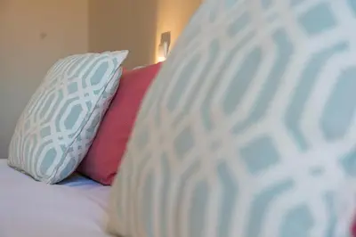 two pillows sitting on top of a bed at GuestReady - Cardosas Town Apartment in Porto