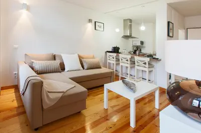 a living room with a couch and a table at BO - Bolhão Apartments in Porto