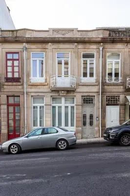 a silver car parked in front of a building at Beautiful Loft Downtown Porto in Porto