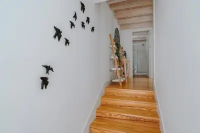 a hallway with bats on the wall in a house at Lovely Nest Downtown Porto in Porto