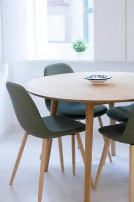 a wooden table with four green chairs around it at Porto City Cottage in Ribeira neighborhood in Porto