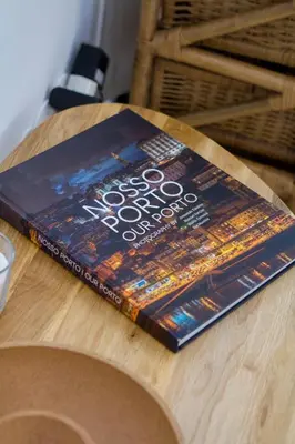 a book sitting on top of a wooden table at Porto City Cottage in Ribeira neighborhood in Porto
