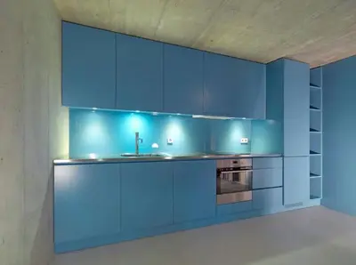a blue kitchen with a sink and a stove at Breiner 310 Downtown Porto Boutique Apartments in Porto