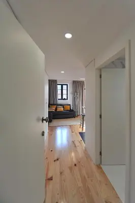 an open door to a living room with a couch at FLH Oporto Wine Cellars Luxury Apartment II in Vila Nova de Gaia