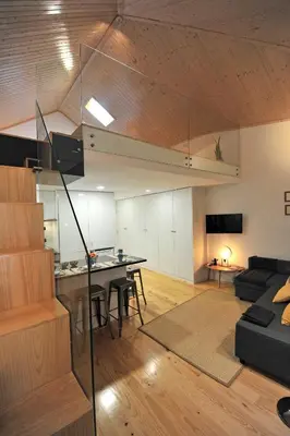 a living room with a couch and a table at FLH Oporto Wine Cellars Luxury Apartment II in Vila Nova de Gaia