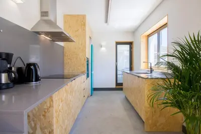 a kitchen with a counter and a sink in a room at Santa Catarina Roof Top in Porto