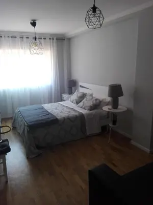 a bedroom with a large bed and a window at Secondlove in Porto
