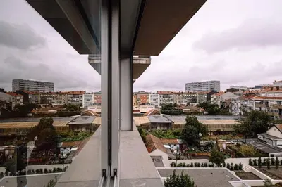 a view of a city from the window of a building at Porto bica velha - Carvalhido in Porto
