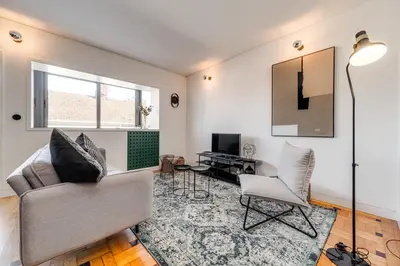 a living room with a couch and a chair at Nomad's Family - 2BED Spacious Apartment Gaia in Vila Nova de Gaia