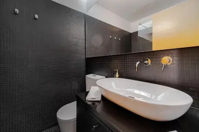 a bathroom with a sink and a toilet at Nomad's Family - 2BED Spacious Apartment Gaia in Vila Nova de Gaia