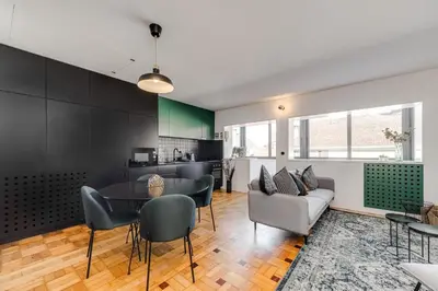 a kitchen and living room with a table and chairs at Nomad's Family - 2BED Spacious Apartment Gaia in Vila Nova de Gaia