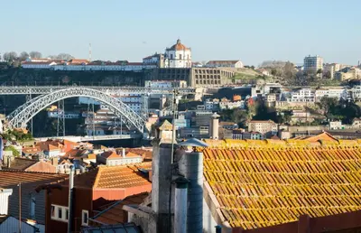 a view of a city with a bridge and buildings at Olival 54 Apartments in Porto