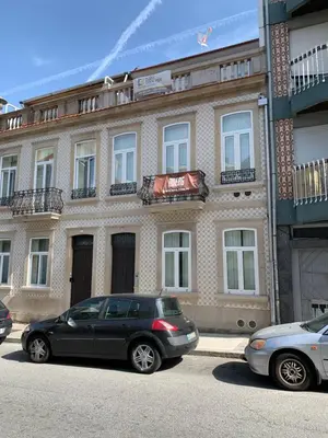 a black car parked in front of a building at D858 - comfort near downtown - AC & balcony in Porto