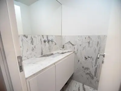 a white bathroom with a sink and a mirror at Oporto City View - Alves da Veiga in Porto