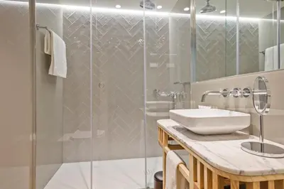 a door leading into a room with a bedroom at Pur Oporto Boutique Hotel by actahotels in Porto