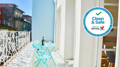 a sign for a clean and safe restaurant on a balcony at OHH - Caldeireiros Luxury Apartments in Porto