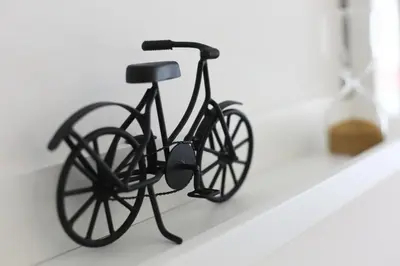 a black bike is sitting on a shelf at Trindade Family Apartment w/ Parking Place in Porto