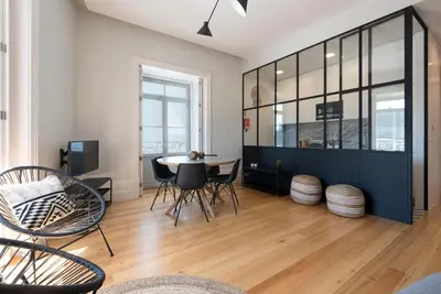 a living room with a table and chairs at Quayside Douro River in Porto