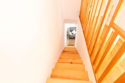 a staircase in a house with wooden floors at Design Boavista Music Apartments in Porto