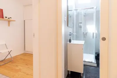 a bathroom with a shower and a sink at Design Boavista Music Apartments in Porto