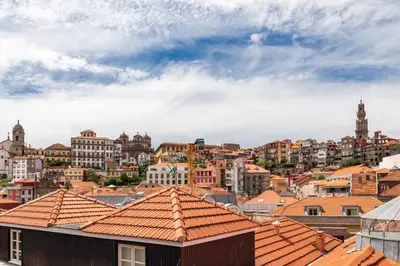 a view of a city with buildings and roofs at Oporto Amazing View Apartment in Porto